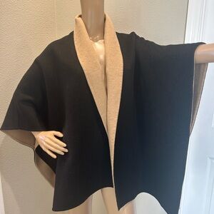 Black shawl-collar capelet with camel color lining